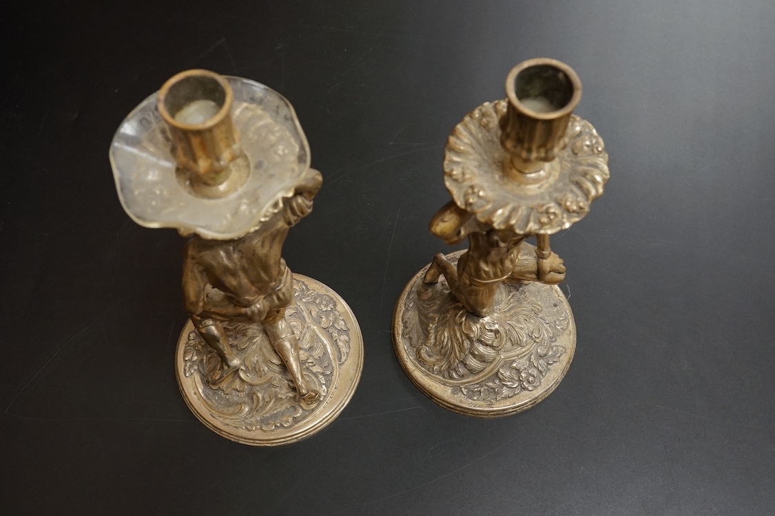 A pair of Blackamoor silvered brass candlesticks, 19cm high